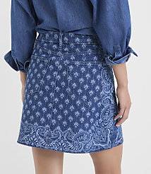 A person wearing a denim shirt and a patterned denim skirt stands against a plain background. carousel Product Image 3