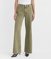 A woman in olive green flared jeans and black heels stands against a plain white background. carousel Product Image 1