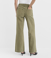 A person wearing olive green wide-leg jeans and black heels stands against a plain white background. carousel Product Image 3