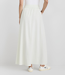A person wearing a light green maxi skirt and sneakers stands against a plain white background. carousel Product Image 3