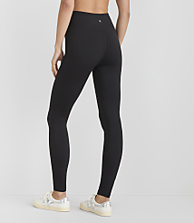 A person wearing black leggings and white sneakers stands against a plain white background. carousel Product Image 3