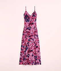 A pink floral dress with spaghetti straps is displayed against a soft pink background. carousel Product Image 4
