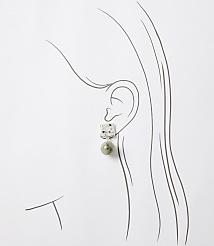 A square-shaped earring with a speckled pattern hangs from a stylized ear, set against a simple white background. carousel Product Image 2