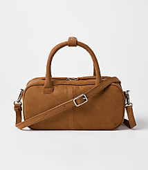 A brown suede duffel bag with a crossbody strap rests on a plain white background. carousel Product Image 1