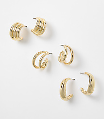 Three pairs of gold hoop earrings with varying designs are arranged on a plain white background. carousel Product Image 1