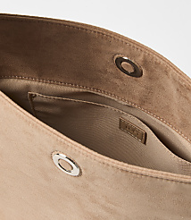 A tan suede clutch with a small interior pocket and silver snap closures is shown against a plain white background. carousel Product Image 2