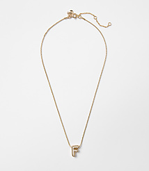 A delicate gold necklace with an "F" initial pendant hangs against a plain white background. carousel Product Image 1