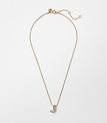 A delicate gold necklace with a stylized "J" pendant hangs against a plain white background. carousel Product Image 1