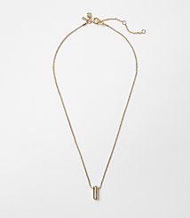 A delicate rose gold necklace with a minimalist bar pendant hangs against a plain white background. carousel Product Image 1