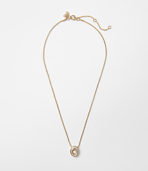 A delicate gold chain necklace with an oval, amber-colored pendant hangs against a plain white background. carousel Product Image 1