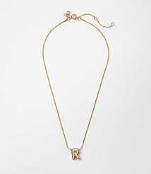 A delicate rose gold chain necklace with a single letter "R" pendant rests on a plain white background. carousel Product Image 1