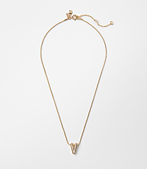 A delicate gold necklace with a "V" pendant hangs against a plain white background. carousel Product Image 1