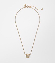 A delicate rose gold necklace with a "W" charm hangs against a plain white background. carousel Product Image 1