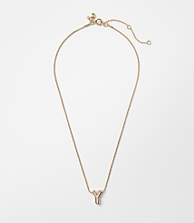 A delicate gold necklace with a lowercase "y" pendant hangs against a plain white background. carousel Product Image 1