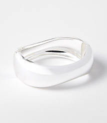 A sleek, silver, wavy bracelet rests on a clean white background. carousel Product Image 1