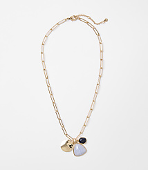 A gold chain necklace with three charms hangs against a plain white background. carousel Product Image 1