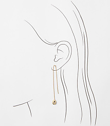 A delicate rose gold threader earring with a small charm dangles from an ear, set against a minimalist line drawing of a woman's head and neck. carousel Product Image 2