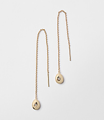 A pair of rose gold threader earrings with small, irregular pendants hang against a plain white background. carousel Product Image 1