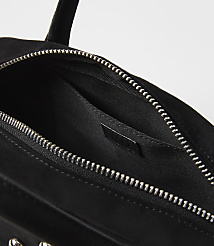 A black suede handbag with a silver zipper is shown against a plain white background. carousel Product Image 2
