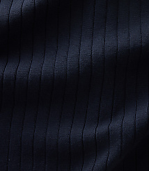 Dark navy ribbed fabric with vertical folds and shadows fills the frame. carousel Product Image 4