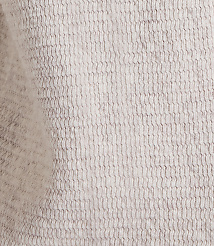 A close-up of a textured, light gray fabric with a subtle wave pattern fills the frame, with soft shadows and highlights creating depth. carousel Product Image 5