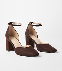 A pair of brown suede ankle strap heels rests on a plain white background. carousel Product Image 1