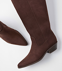 A pair of brown suede knee-high boots with pointed toes and low heels are laid out on a plain white background. carousel Product Image 3