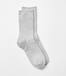 A pair of light gray ribbed socks lies on a plain white background. carousel Product Image 1