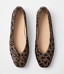 A pair of leopard-print ballet flats with tan insoles rests on a plain white background. carousel Product Image 3
