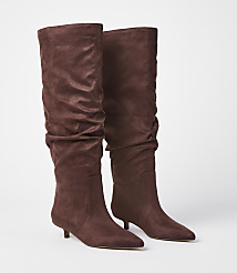 A pair of brown slouchy suede boots with kitten heels stand on a white background. carousel Product Image 1