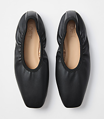 A pair of black ballet flats with a square toe are laid flat against a plain white background. carousel Product Image 3