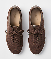 A pair of brown corduroy sneakers with tan insoles and brown laces are laid out on a plain white background. carousel Product Image 3