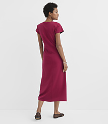 A woman in a maroon dress stands against a plain white background. carousel Product Image 3