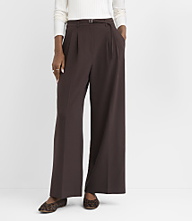 A person stands in front of a white background, wearing brown wide-leg pants and leopard print flats. carousel Product Image 2