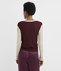 A woman in a maroon and beige sweater and maroon pants stands against a plain white background. carousel Product Image 3