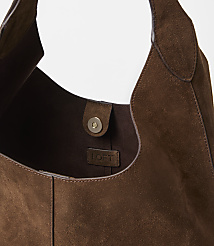 A brown suede hobo bag with a magnetic closure and a "LOFT" tag is shown against a plain white background. carousel Product Image 2