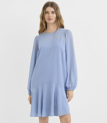 A woman in a light blue, textured dress with voluminous sleeves stands against a plain white background. carousel Product Image 1