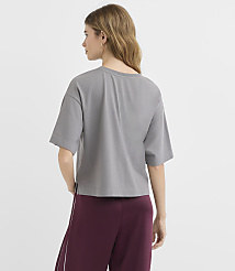 A woman in a grey t-shirt and maroon pants stands against a plain white background. carousel Product Image 3