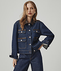A young woman in a denim jacket and jeans stands against a plain gray background. carousel Product Image 4