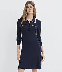 A woman in a navy ribbed polo dress stands against a plain white background. carousel Product Image 1