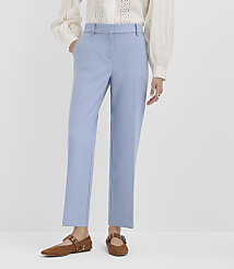 A person stands in light blue trousers and brown flats against a plain white background. carousel Product Image 2