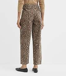 A person wearing leopard-print pants and a brown sweater stands against a plain white background. carousel Product Image 3