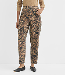 A person wearing leopard print pants and a tan cardigan stands against a plain white background. carousel Product Image 2