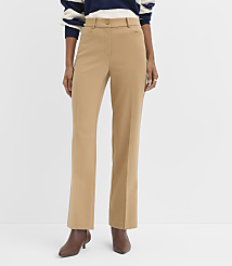 A person stands in front of a white background wearing tan dress pants and brown heeled boots, with a striped sweater visible at the top. carousel Product Image 1