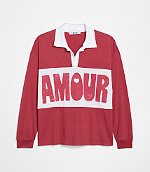 A red long-sleeved polo shirt with "AMOUR" printed in white across the chest is displayed against a plain white background. carousel Product Image 1