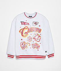 A white sweatshirt with red trim and various Kansas City Chiefs graphics is displayed against a plain white background. carousel Product Image 1