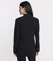 A woman in a black blazer stands against a plain white background. carousel Product Image 3
