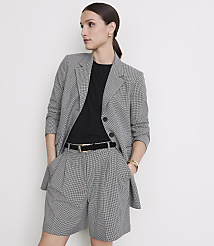 A woman in a black and white checkered blazer and shorts stands against a plain white background. carousel Product Image 2