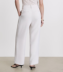 A person wearing cream-colored wide-leg pants and black heels stands against a plain white background. carousel Product Image 3