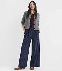 A woman in a gray cardigan and pinstripe pants stands against a plain white background. carousel Product Image 1